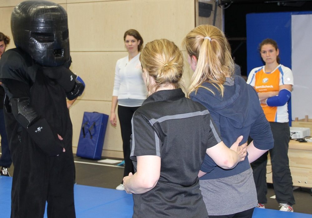 Woman participating in self defense classes